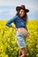 Pregnant woman in a canola field