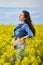 Pregnant woman in a canola field