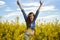 Pregnant woman in a canola field