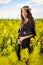 Pregnant woman in a canola field