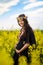 Pregnant woman in a canola field