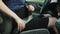 Pregnant woman car driver fastens seat belt