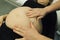 Pregnant woman checked by midwife