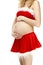 Pregnant woman in a Christmas Santa suit