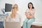 Pregnant woman consulting with gynecologist-obstetrician