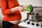 Pregnant woman cooking broccoli