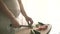 A pregnant woman cuts vegetables belly of pregnant woman and hands sharpen kitchen knife on table.