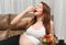 Pregnant woman delicious eating strawberry