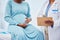 Pregnant woman, doctor hands and checklist in hospital consulting, gynecology service and healthcare test, exam or