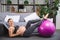 Pregnant woman is doing exercises with gymnastic ball