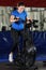 Pregnant woman doing intense workout at gym air bike