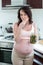 Pregnant woman eating pickles