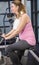 Pregnant woman on exercising bike