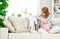 pregnant woman expectant mother prepares clothing items for newborn baby