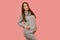 Pregnant woman. Expectation of the child. Maternity leave. Pregnancy of a happy beautiful girl in a gray sweater on a