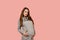 Pregnant woman. Expectation of the child. Maternity leave. Pregnancy of a happy beautiful girl in a gray sweater on a