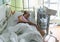 Pregnant woman feels hard contraction in a hospital labor delivery room. Concept photo of pregnancy, pregnant woman