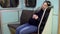 A pregnant woman fell asleep on a subway train. Old subway train car