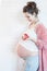 Pregnant woman with fresh apple pregnancy healthcare food and happiness concept