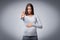 Pregnant woman gesturing stop forbidding or warning posing in studio