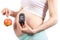 Pregnant woman with glucometer and apple, diabetes and healthy nutrition during pregnancy