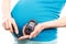 Pregnant woman with glucose meter checking sugar level, diabetes during pregnancy