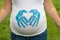 Pregnant woman with handprints on shirt