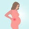 A pregnant woman has a backache. Back stress during pregnancy
