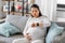 pregnant woman having labor contractions at home