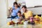 Pregnant woman and her family breakfasting in the kitchen