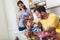 Pregnant woman and her family breakfasting in the kitchen