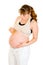 Pregnant woman holding baby dummy near belly