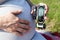 Pregnant woman holding blood glucose meter to prevention diabetes, close-up view