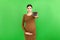 Pregnant woman holding a pile of blisters of pills at colorful background with copy space. Vitamins during pregnancy concept