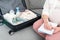Pregnant woman at home writes list and packs suitcase for maternity hospital stay