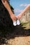 Pregnant woman and man holding baby shoes in hands. Future mom and dad, parents is holding little newborn baby shoes.