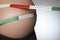 Pregnant Woman Measuring Belly With Tape Measure