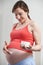 Pregnant Woman Moisturizing Belly