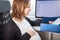 Pregnant woman in the office, business during pregnancy, employment, modern career
