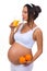 Pregnant woman and oranges and fresh juice. Isolated on white background
