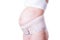 Pregnant woman with orthopedic support belt,  on white background