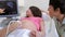 Pregnant Woman And Partner Having Ultrasound Scan