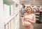 Pregnant woman at pharmacy or cosmetics store