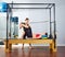 Pregnant woman pilates reformer leg spring