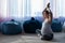 Pregnant woman practice yoga. A woman in the third trimester leads Pilates. Classes to prepare for childbirth. Waiting
