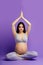 Pregnant woman practicing prenatal yoga, preparing body to natural childbirth