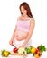 Pregnant woman preparing food .