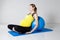 Pregnant woman relaxing against fitness ball