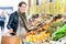 Pregnant woman shopping groceries on farmers market