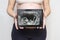 Pregnant woman shows a picture of a baby ultrasound scan on a tablet. Healthy pregnancy. Concept of Pregnancy health care